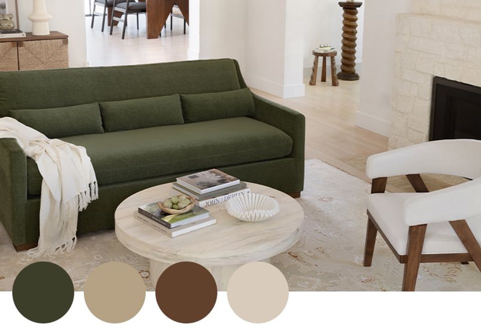 Modern organic room featuring forest green sofa, warm wood, cream, and earthy brown tones in calm palette