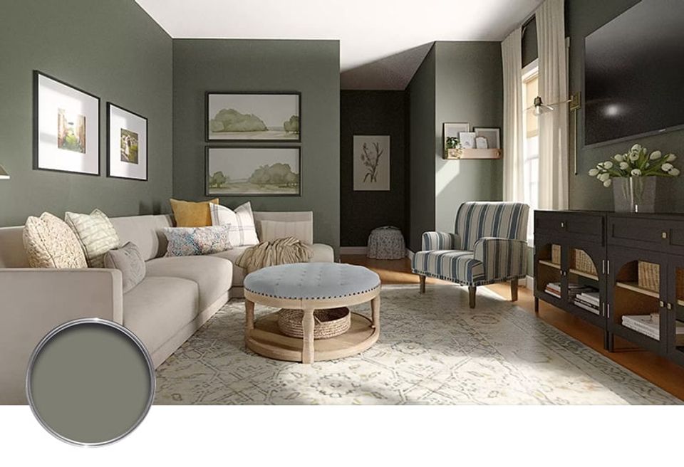 Serene living room in muted sage green with neutral upholstery, natural wood accents, and layered textures creating inviting comfort