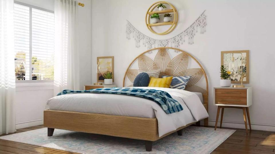 Warm mid-century bedroom with rattan circular headboard, natural wood, and navy accent pillows