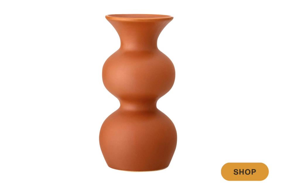 Terracotta sculptural vase with organic, modern silhouette