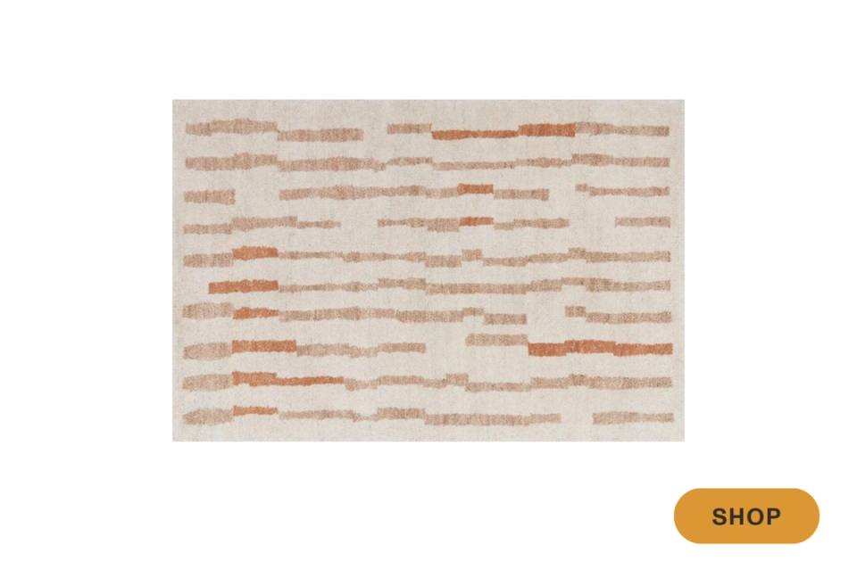 Warm terracotta and beige textured area rug with horizontal brick-like pattern, earthy bohemian vibe