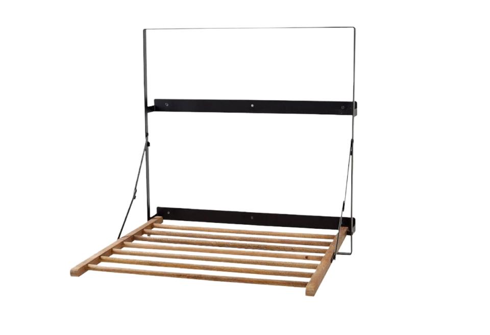 Modern murphy bed with black metal frame and natural wood slats, space-saving design