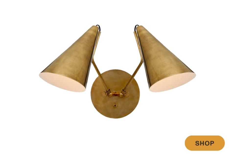 Vintage-inspired brass dual cone wall sconce with warm metallic finish