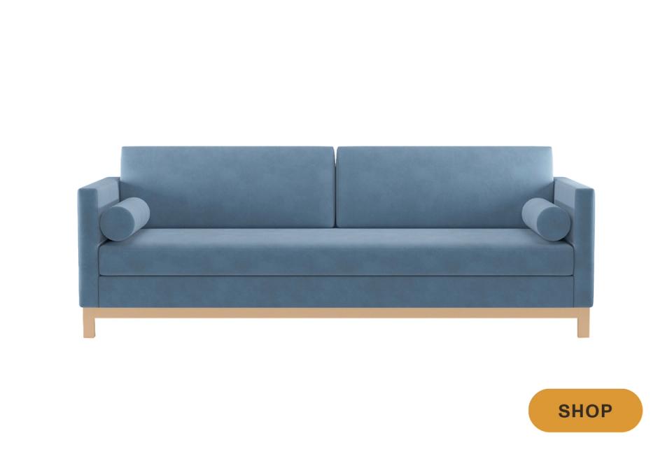 Scandinavian-style slate blue sofa with wooden legs and minimalist appeal