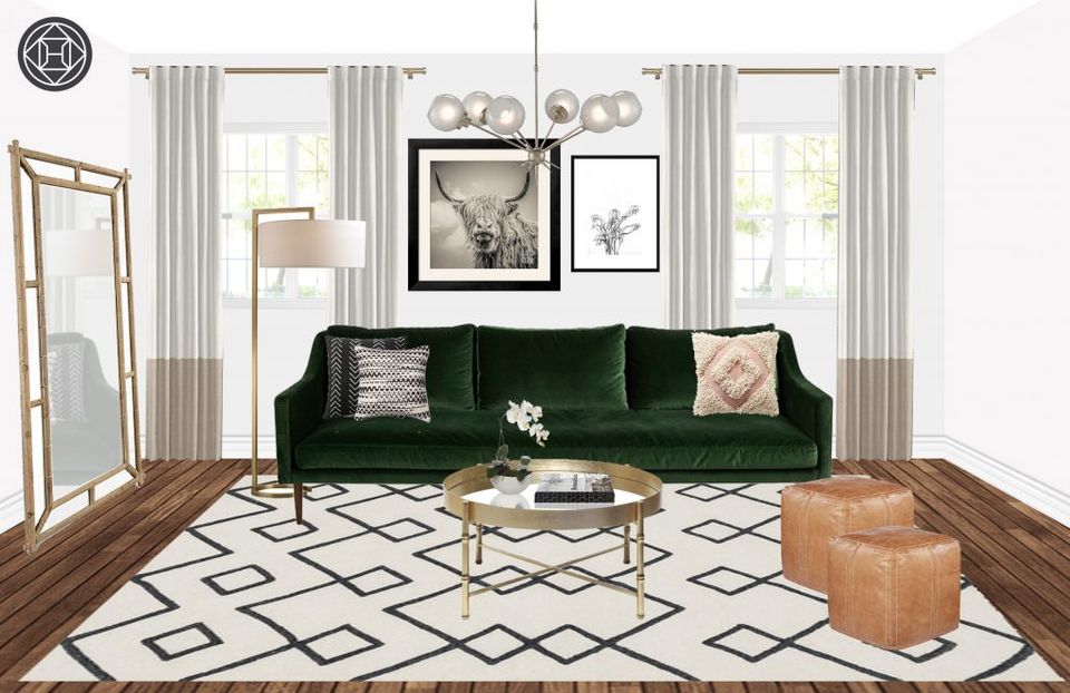 Warm hygge space: forest green velvet sofa, wood floors, geometric rug, natural light, and earthy leather accents