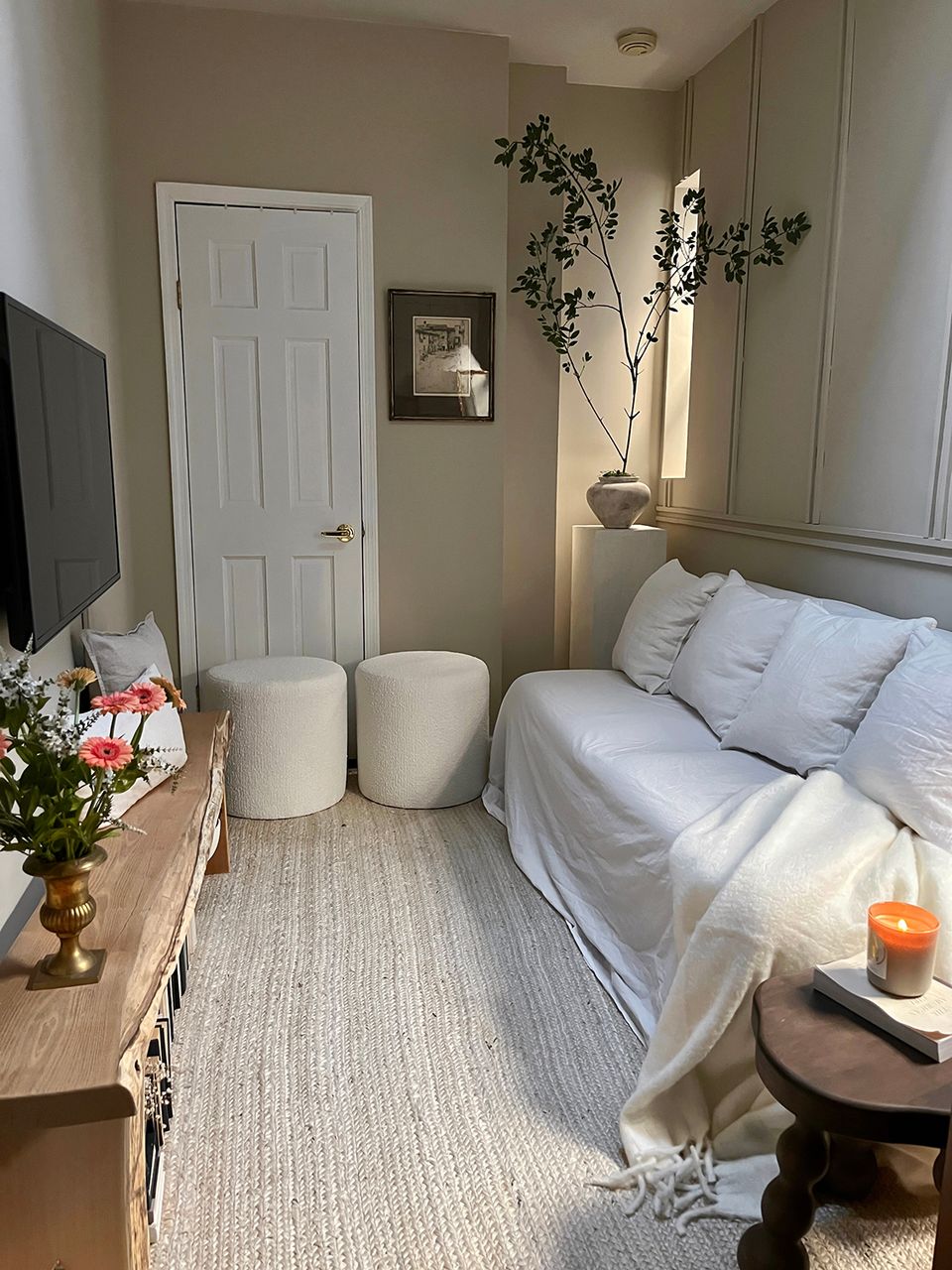 Serene bedroom with soft blues, natural wood accents, and minimalist furnishings creating calm sanctuary