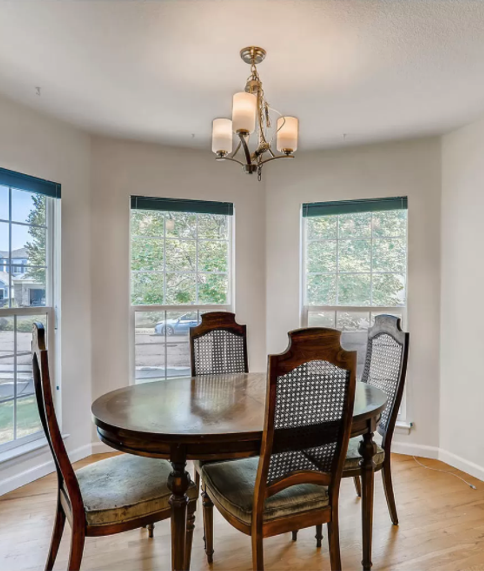 Clean contemporary dining with dark wood table and neutral modern aesthetic