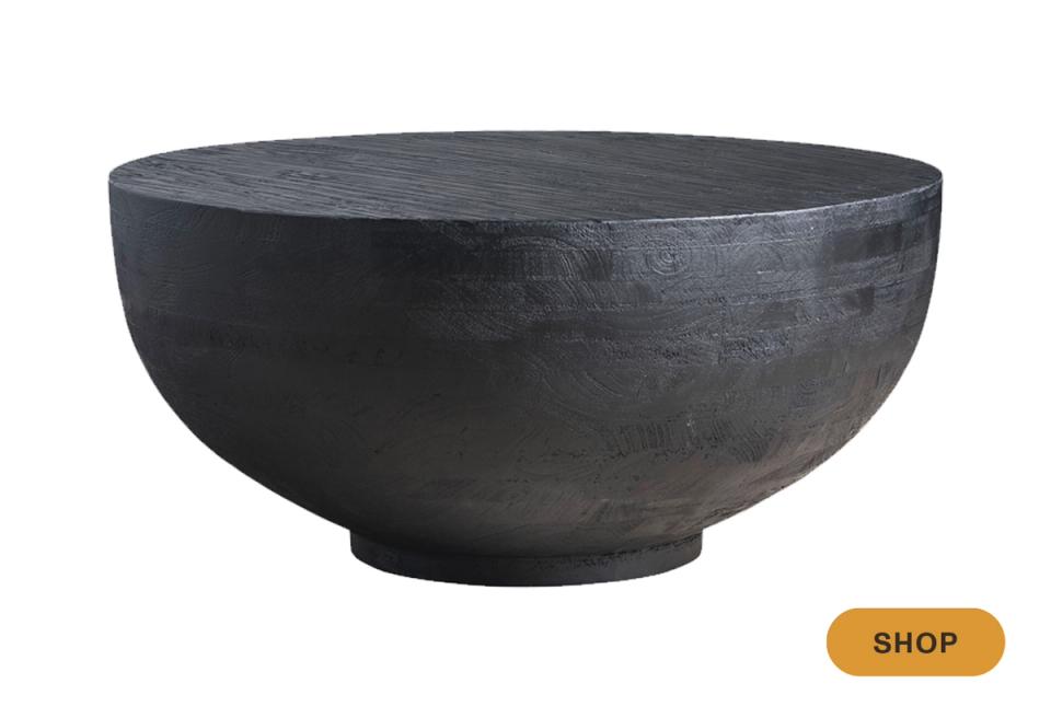 Industrial charcoal concrete round coffee table with sculptural bowl-shaped design