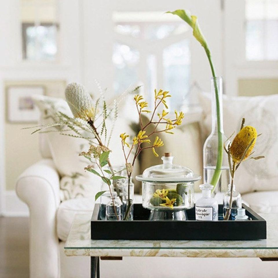 Serene botanical vignette with fresh florals, cream furniture, and soft natural light creating peaceful ambiance