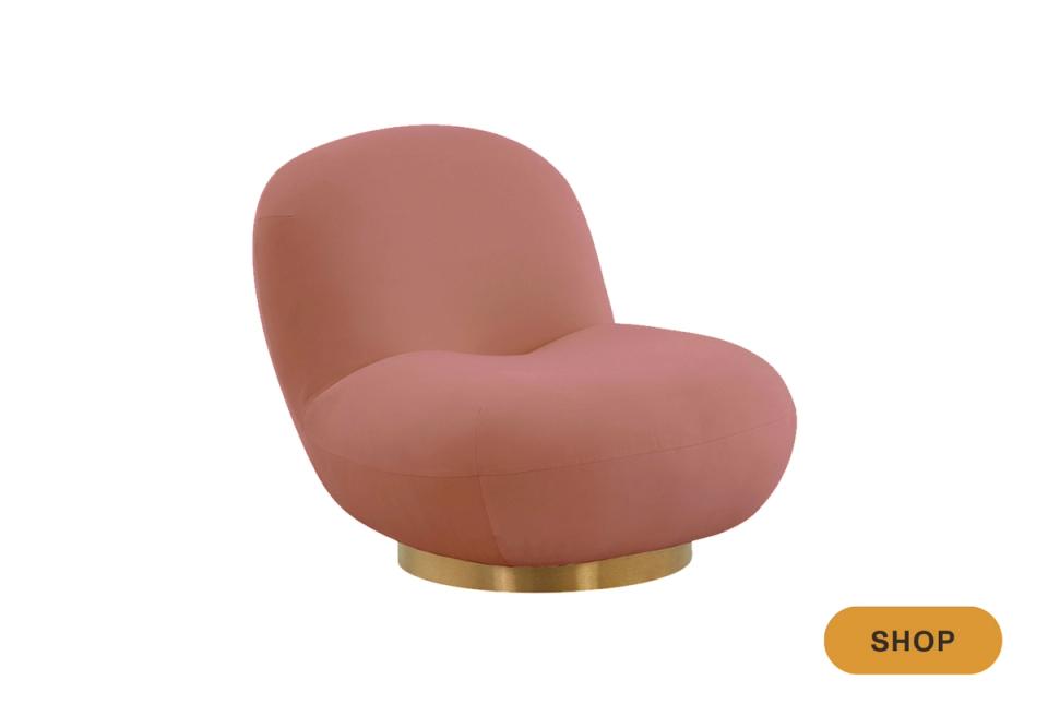 Contemporary blush pink curved swivel chair with brass base