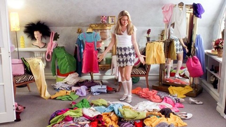 Bright, chaotic closet space with neon colors, hanging racks, and playful teen energy