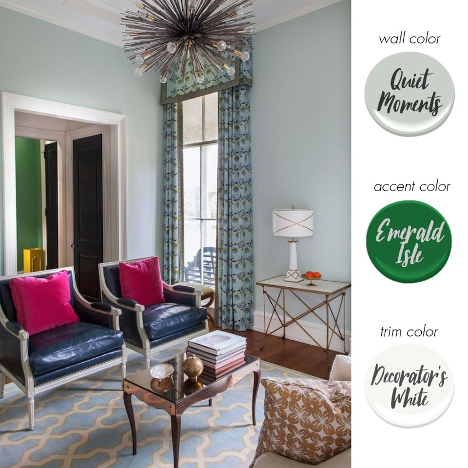 Contemporary sitting area with soft sage walls and jewel-tone accent pieces