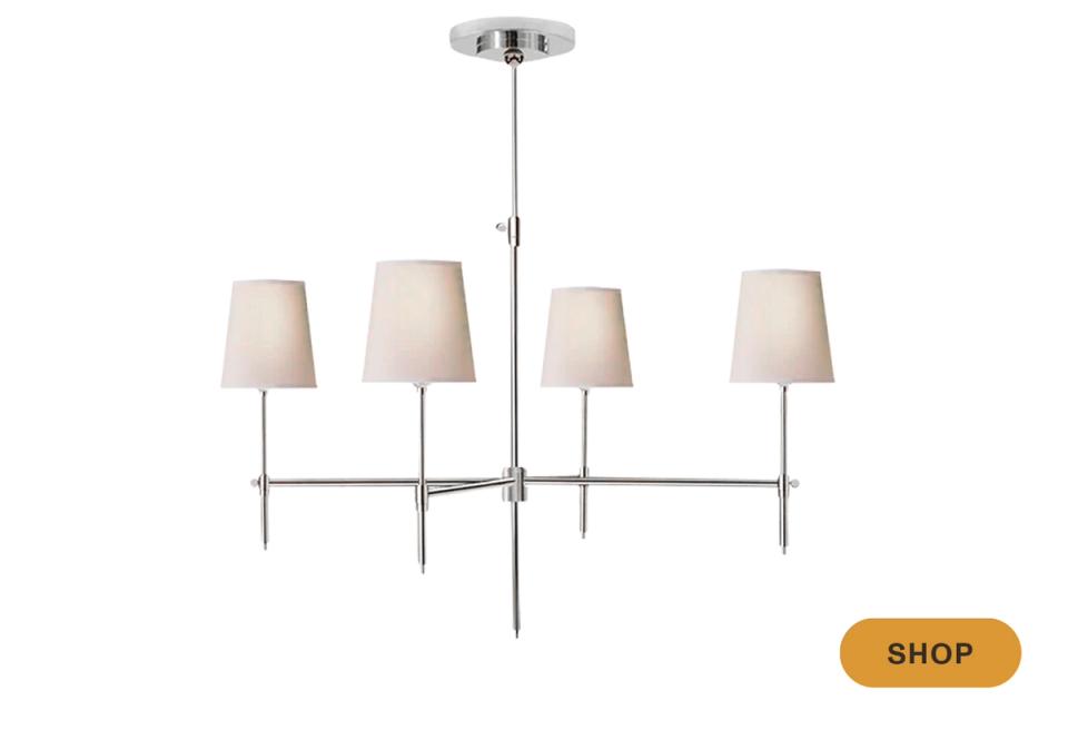 Modern minimalist chandelier with chrome hardware and cream linen shades, transitional style