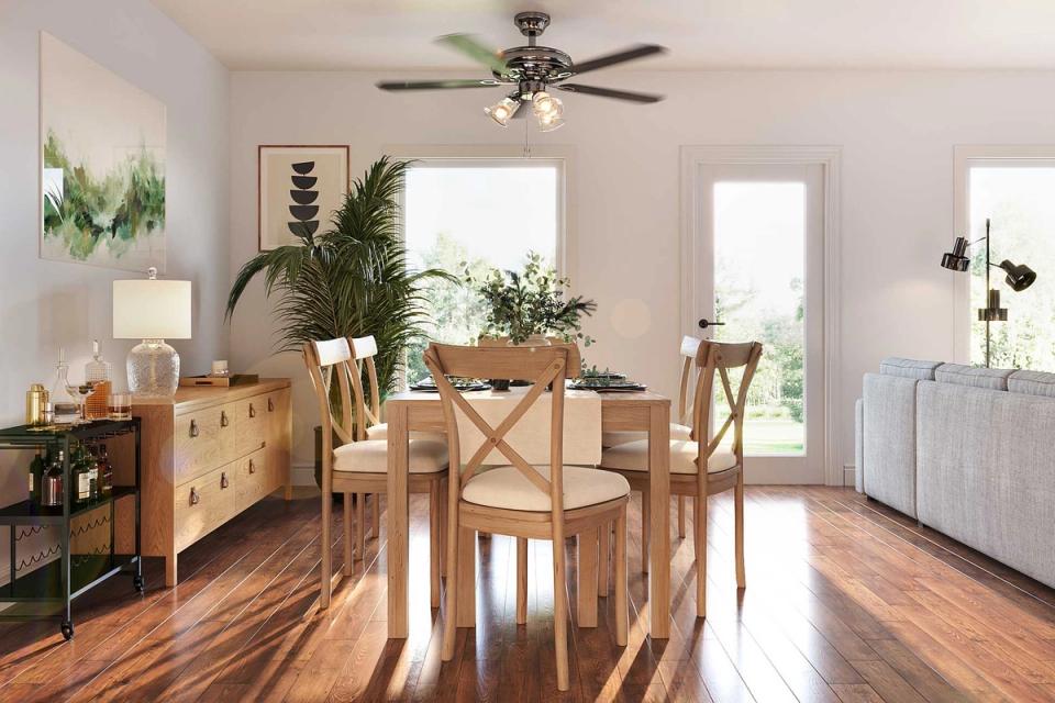 Bright dining area with light wood furnishings and soft Gray Mist palette throughout