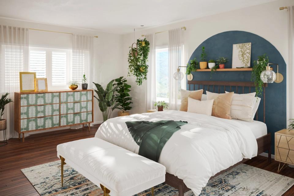 Contemporary bedroom with blue arched headboard wallpaper and serene botanical styling