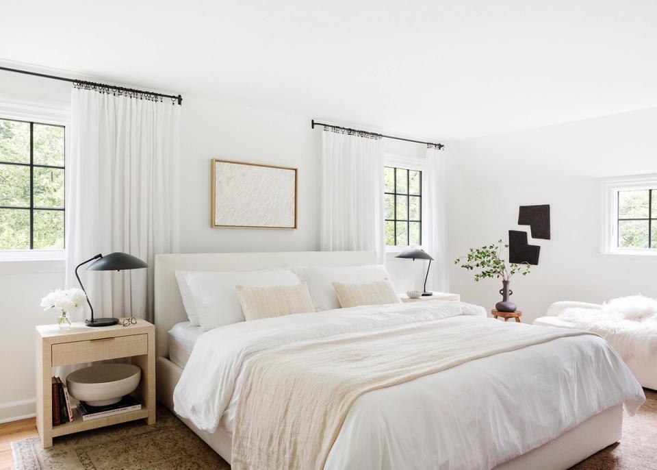 Bright Scandinavian bedroom with soft cream palette, natural wood, and airy minimalist warmth