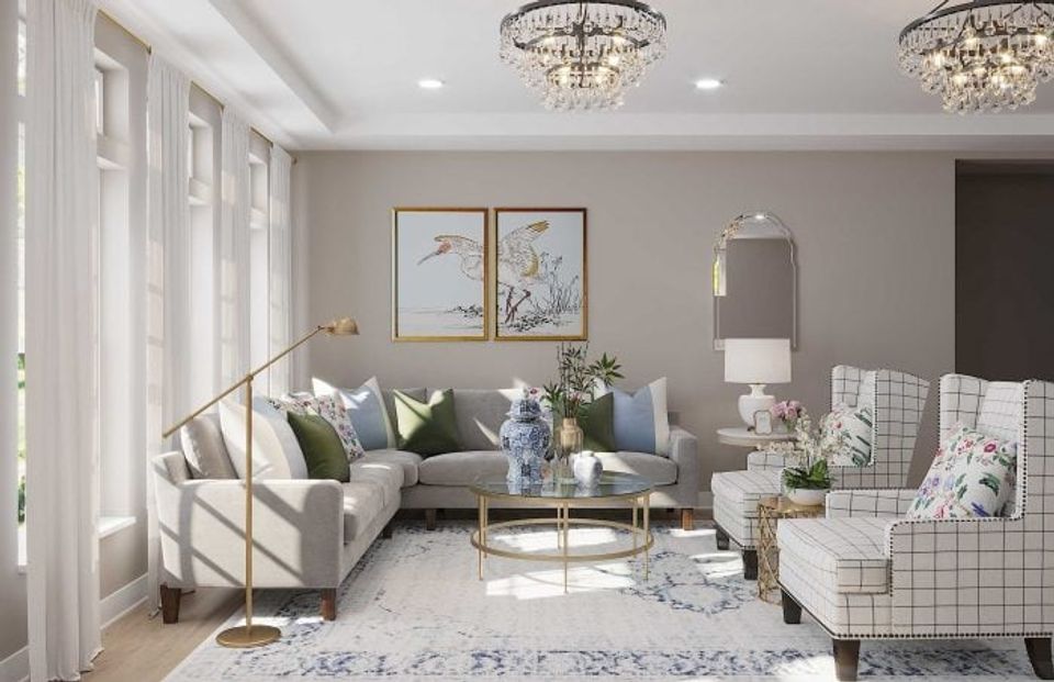 Sophisticated traditional living room in soft greens and grays with crystal chandeliers, botanical art, and refined furnishings exuding understated luxury.