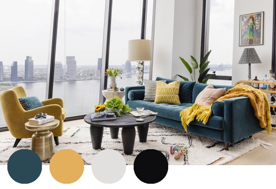 Modern urban living room with teal, mustard, and black creating bold contrast against floor-to-ceiling city views