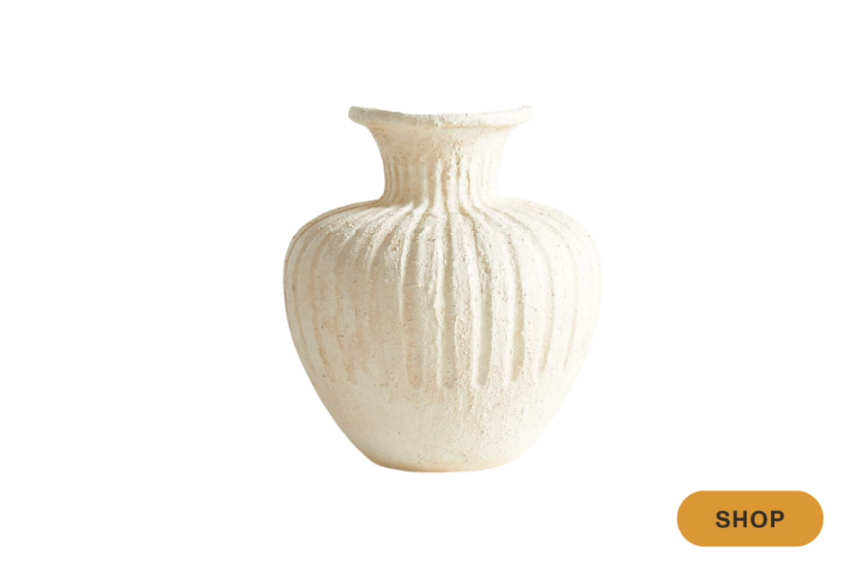 Sculptural cream ceramic vase with ribbed organic form