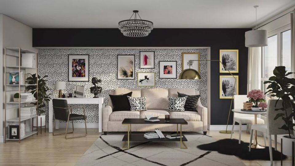Curated gallery-style living room with black walls, white trim, cream furnishings, and artistic display for editorial polish