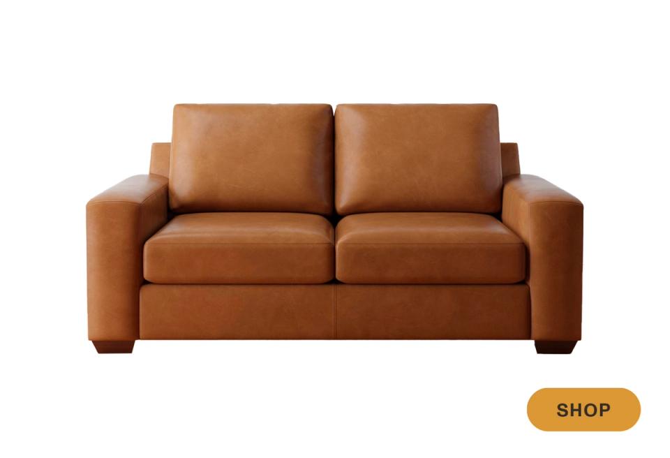 Contemporary caramel leather sofa with chunky square arms and compact footprint