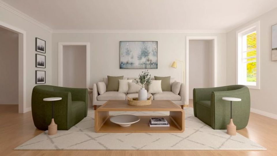 Contemporary living room featuring forest green curved chairs, natural wood elements, and minimalist styling in a light, refined palette