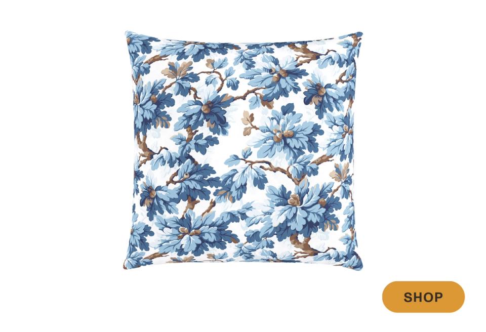 Classic blue and white floral throw pillow with birds and botanical motifs