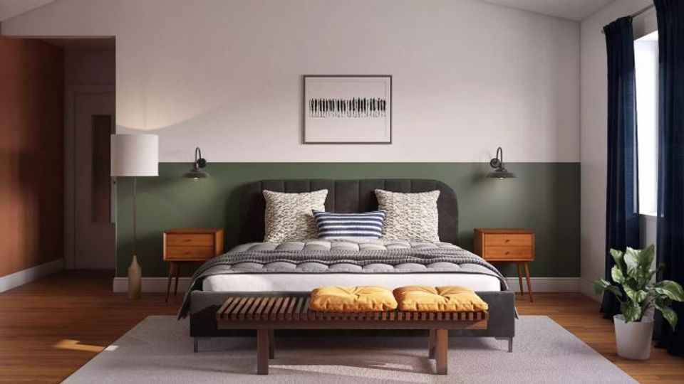 Modern bedroom with forest green accent wall and mid-century wood furniture