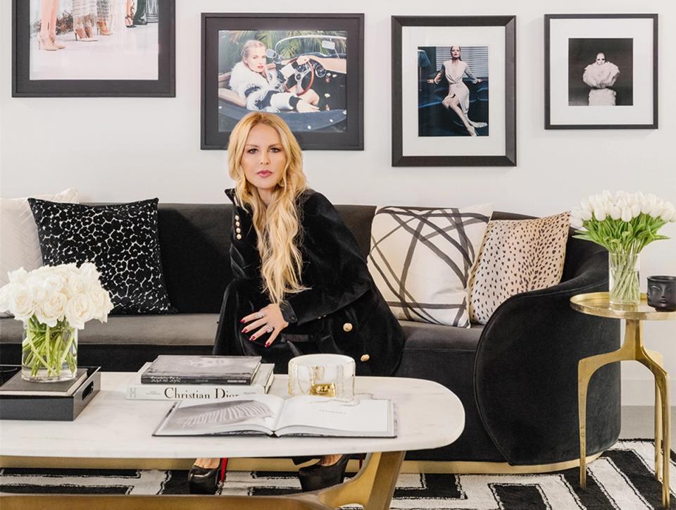Sophisticated black and white living room with gallery wall, leopard accents, and glamorous styling