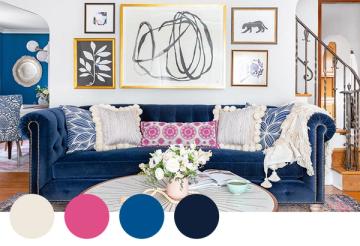Bold eclectic space featuring deep navy sofa with vibrant pink and gold gallery wall, playful maximalist mood