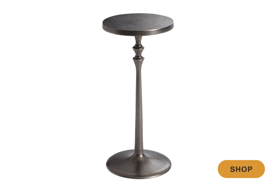 Classic industrial martini table in aged metal with round top and tapered stem