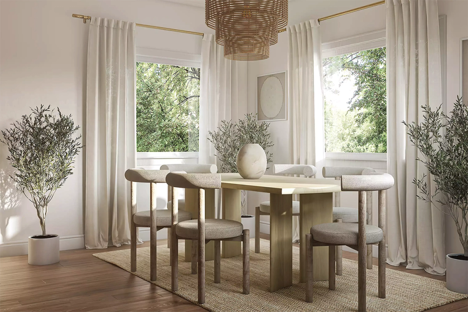 Serene Scandinavian dining space with light wood table, natural textiles, and lush greenery