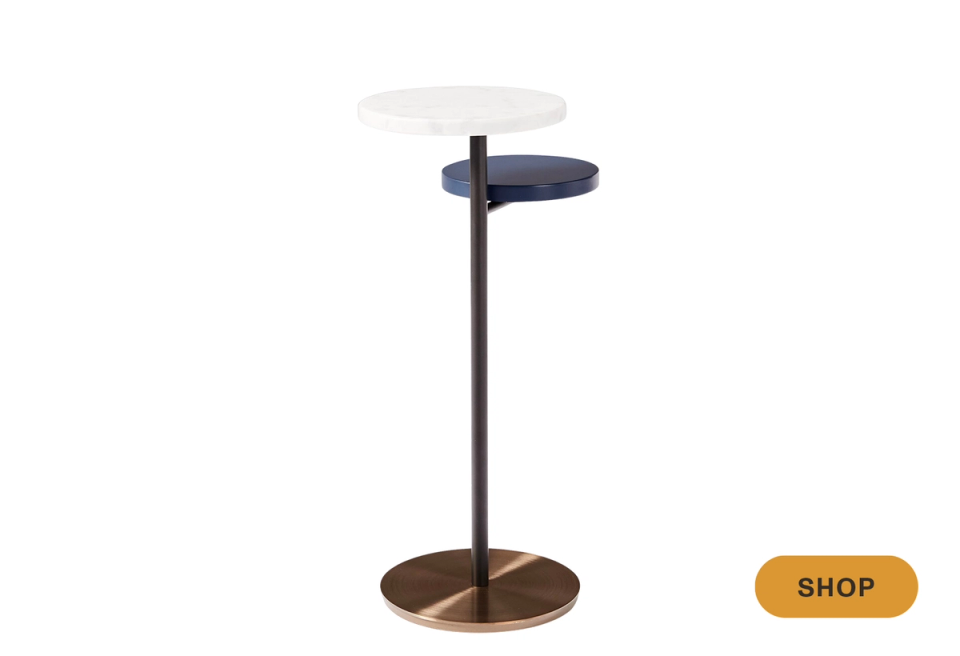 Modern minimalist martini table with stacked circular tops in navy, white, and wood