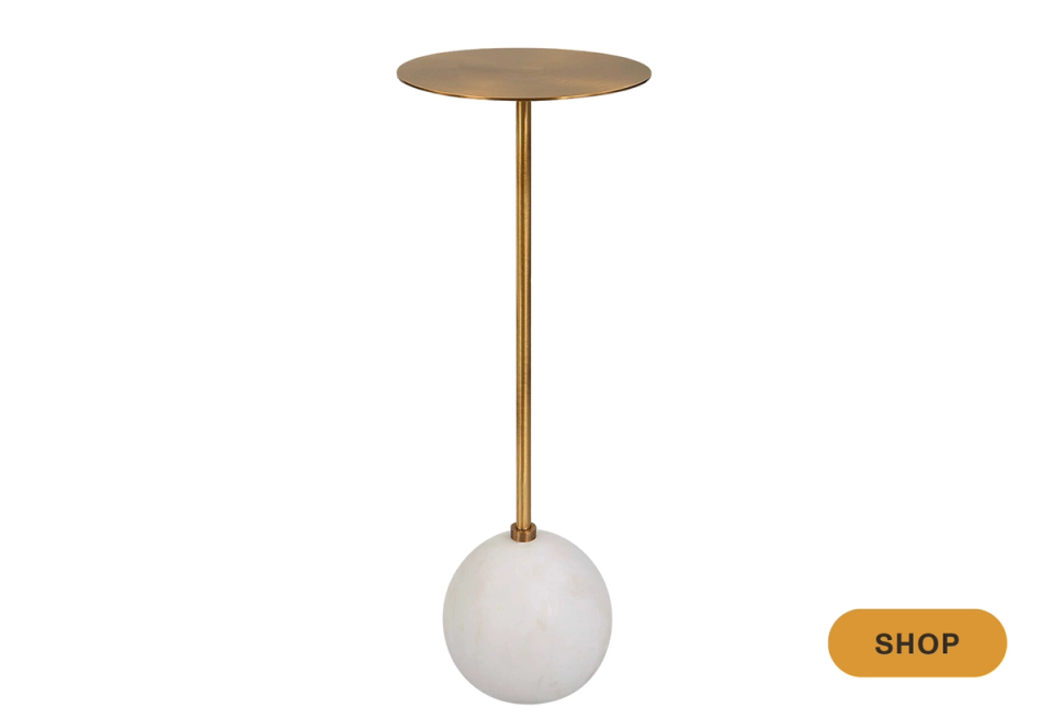 Modern brass and cream martini table with spherical base and elegant proportions