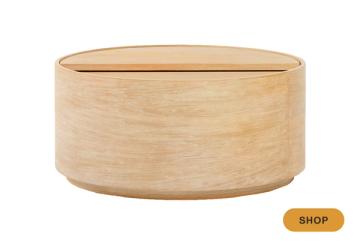 Minimalist light wood round storage table with clean cylindrical silhouette