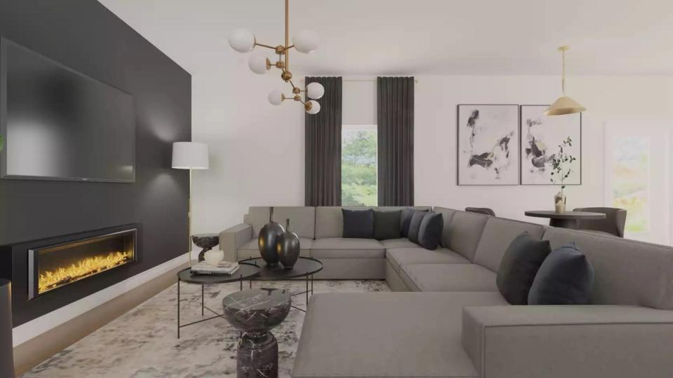 Minimalist dark academia with linear fireplace, gray sectional, brass lighting, and refined symmetry