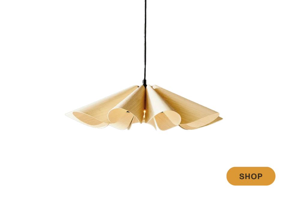 Glamorous brass petal-shaped pendant with sculptural designer aesthetic and golden warmth