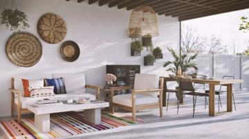 Bohemian rooftop retreat mixing woven wall art, natural wood furnishings, colorful accents, and global-inspired textures.