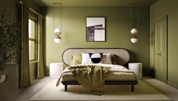 Modern bedroom with rich sage green walls, curved headboard, pendant lighting, and layered textiles in contemporary earth-toned palette.