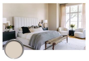 Serene neutral bedroom with white vertical-paneled headboard, soft taupe walls, gentle natural light, and layered soft furnishings evoking calm sophistication.