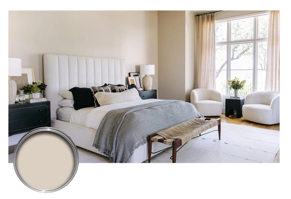 Serene neutral bedroom with white vertical-paneled headboard, soft taupe walls, gentle natural light, and layered soft furnishings evoking calm sophistication.