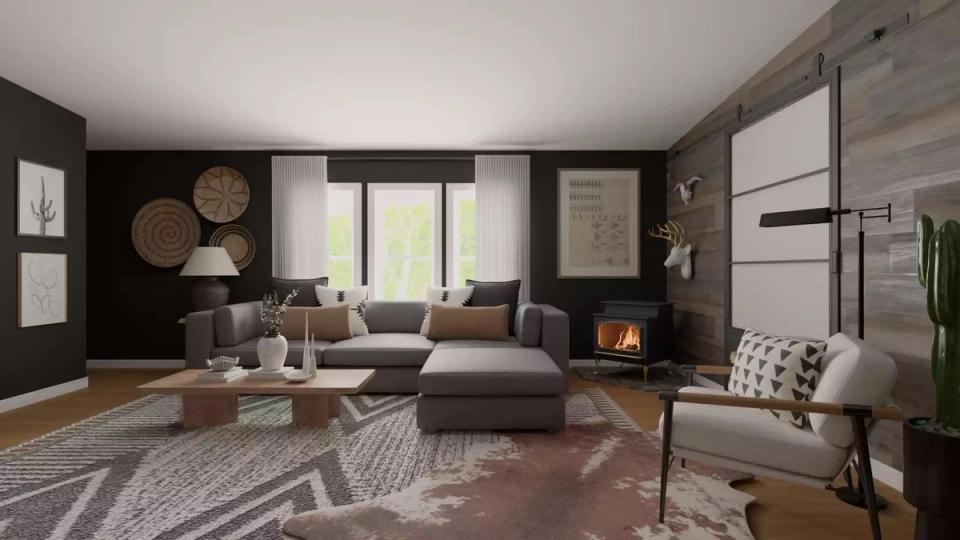 Atmospheric living room with black walls, fireplace glow, warm wood flooring, and cozy layered seating