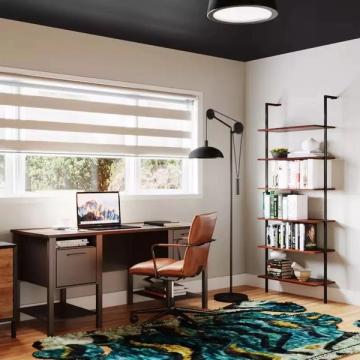 Contemporary home office with black ceiling, mid-century wood desk, teal patterned rug, and industrial shelving in warm neutral tones.