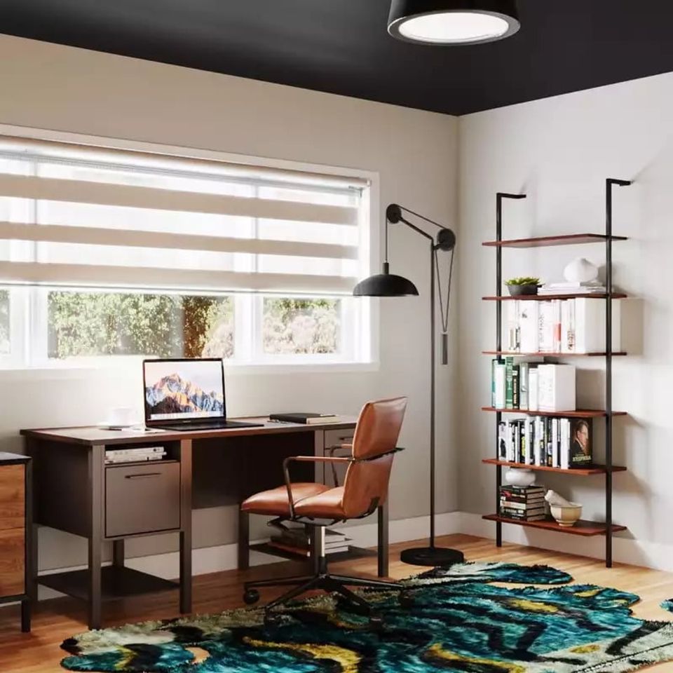 Contemporary home office with black ceiling, mid-century wood desk, teal patterned rug, and industrial shelving in warm neutral tones.