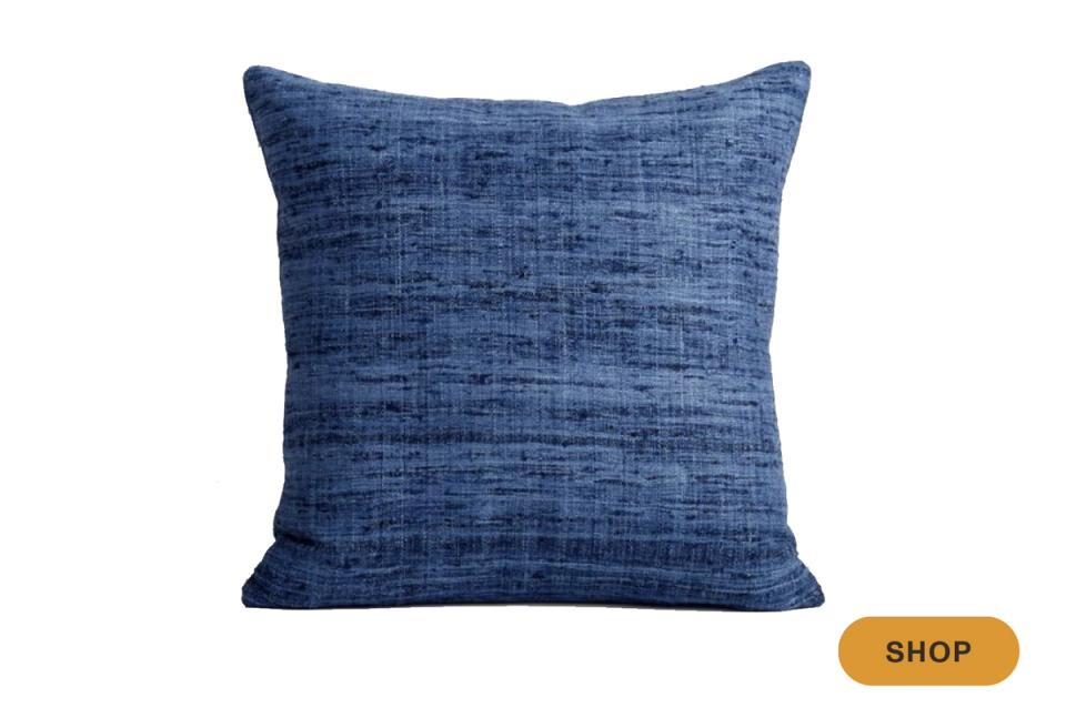 Textured blue throw pillow with linen weave fabric in deep navy