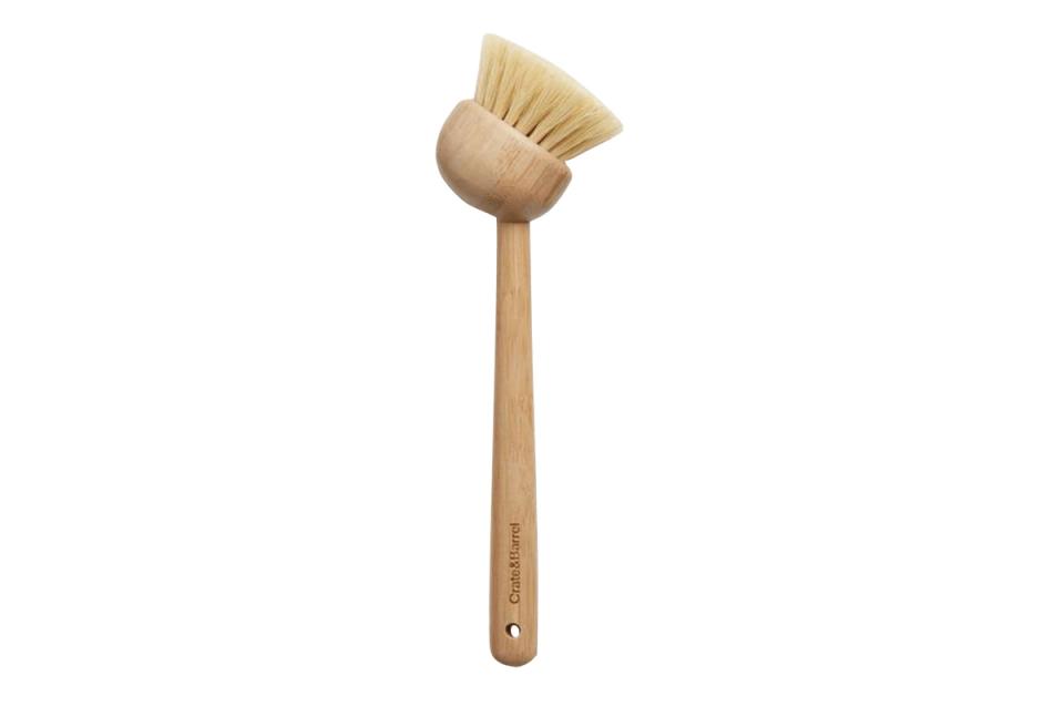 Contemporary wooden cleaning brush with natural bristles and minimalist aesthetic