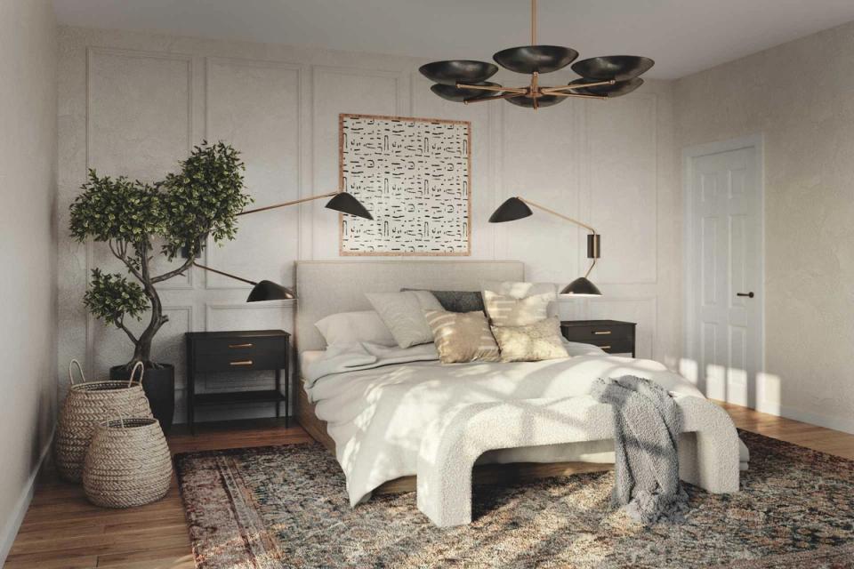 Scandinavian mid-century bedroom with warm wood floors, neutral palette, black metal bed frame, and minimalist pendant lights
