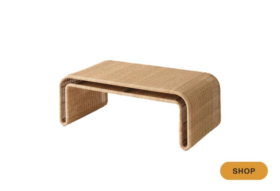 Organic modern woven rattan coffee table with sculptural curved silhouette