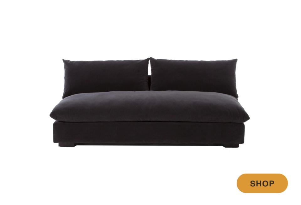 Sleek black contemporary sofa with low-profile cushioned seating