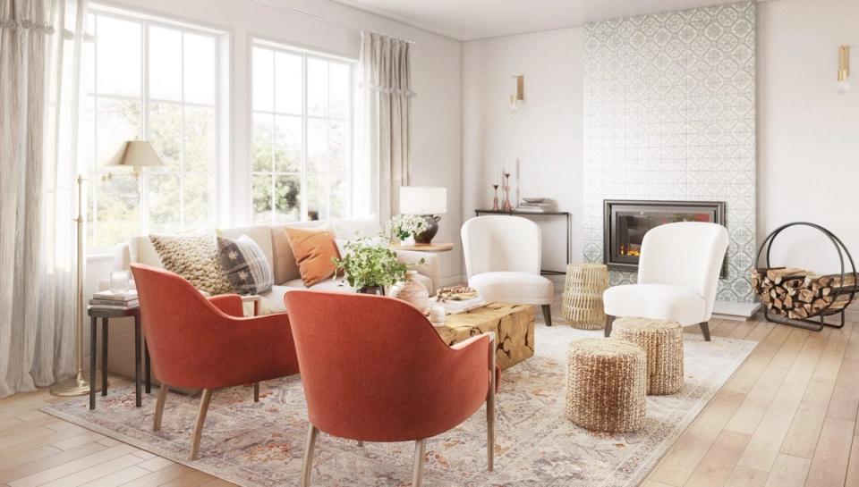 Bright mid-century living room with rust-orange accent chairs, natural wood flooring, and neutral walls creating a warm, inviting modern aesthetic.